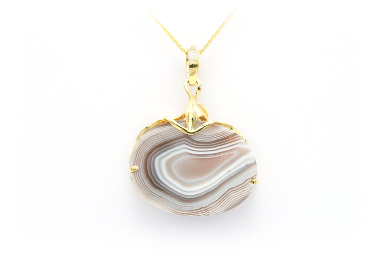 Pendentif Pendentif Années 70 en or jaune 18 carats serti d'une agate et d'un diamant "taille" brillant (+-0.025cts) 58 Facettes B673