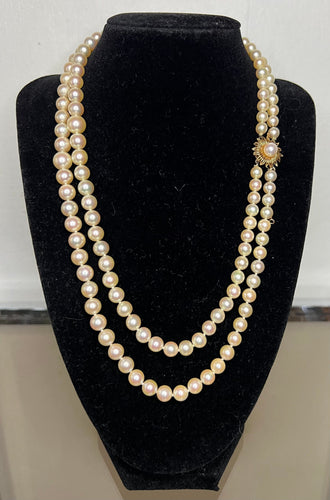 Collier Collier double rangs 132 perles de culture fermoir fleur en or jaune 58 Facettes