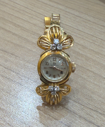 Montre Montre Omega ancienne en or  18 carats et diamants 58 Facettes
