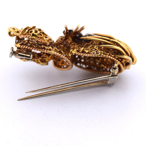 Broche Broche en or jaune et or blanc avec émeraudes et diamants 58 Facettes