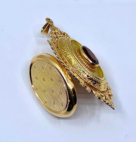 Pendentif Pendentif porte souvenir ouvrant en or et grenat 58 Facettes AB574