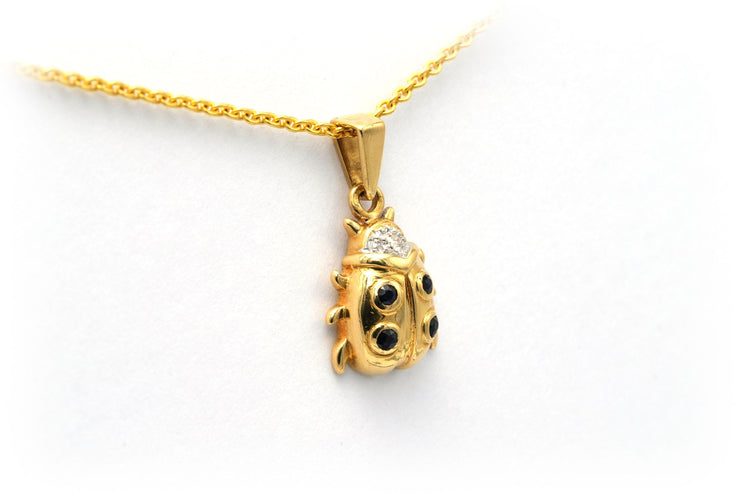 Pendentif Pendentif "coccinelle" contemporain en or jaune serti de saphirs et de diamants 58 Facettes 20754