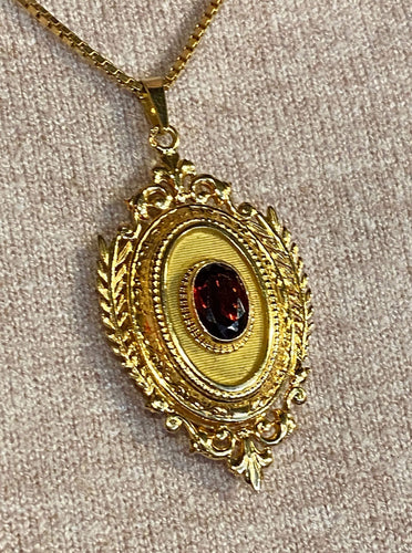 Pendentif Pendentif porte souvenir ouvrant en or et grenat 58 Facettes AB574