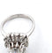 Bague 53 Bague en or blanc avec diamant central et diamants environnants 58 Facettes