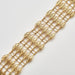 Bracelet Cuff bracelet with openwork decoration in yellow gold 58 Facettes
