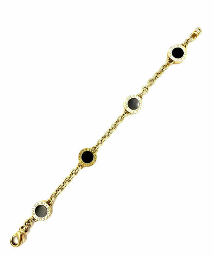 Bracelet BVLGARI. Collection "BVLGARI-BVLGARI", bracelet or jaune et onyx 58 Facettes
