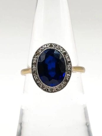 Bague 50.5 Bague Pompadour deux ors ornée d'une pierre bleue et de diamants 58 Facettes