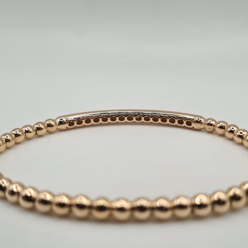 Bracelet or rose 18 carats en billes d’or et barrette de diamants naturels