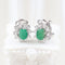 Boucles d'oreilles Boucles d'oreilles halo en or blanc 18k, émeraudes ovales et diamants 58 Facettes 125977F