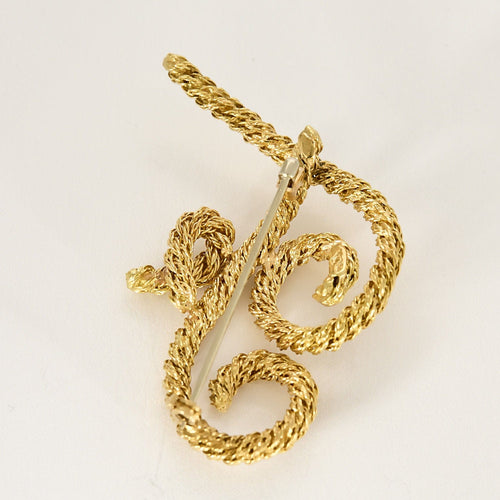 Broche Broche en or jaune à motif de volutes torsadées 58 Facettes COMP0987