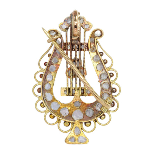 Diamants et harmonie : la broche-pendentif lyre en or des années 1870
