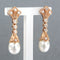 Boucles d'oreilles Boucles d'oreilles en or rouge avec perle et diamants taille simple 58 Facettes
