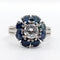 Bague 52 Bague marguerite Art déco en platine et diamant 0,65 ct, saphirs 58 Facettes A06577