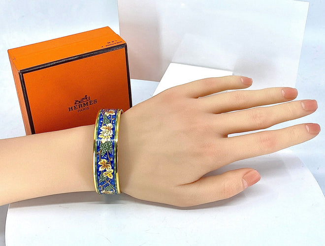 Bracelet HERMÈS - bracelet en métal doré et émail 58 Facettes AB657