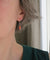 Boucles d’oreilles dormeuses pendantes or blanc corail 58 Facettes