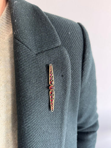 Broche Art Déco or jaune et grenats