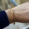 Bracelet jonc ouvrant grand modèle en or jaune 18k