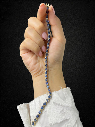 Bracelet Bracelet tennis en or jaune avec saphirs et diamants 58 Facettes