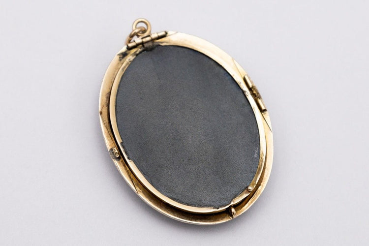 Pendentif Pendentif ancien en onyx avec emplacement pour photo, fin du XIXe siècle 58 Facettes 10566A