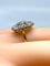 Bague Importante bague marguerite en or 18 carats et diamants 58 Facettes AB338