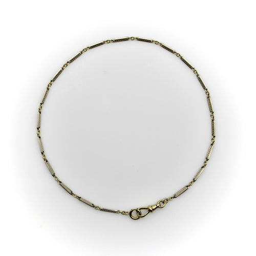 Montre Chaîne de montre Art Déco bicolore en or 10 carats avec fermoir mousqueton et anneau à ressort en or 14 carats 58 Facettes A20057