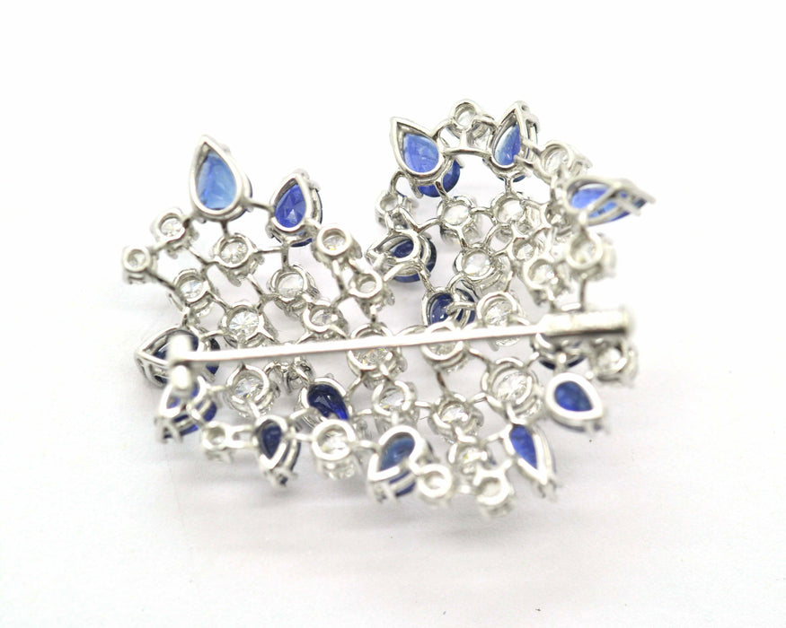 Broche Broche en or blanc avec diamants et saphirs 58 Facettes