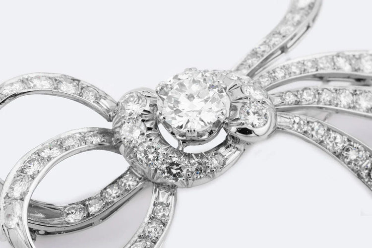 Broche Oro Bianco Broche nœud vintage avec diamants 58 Facettes spl112