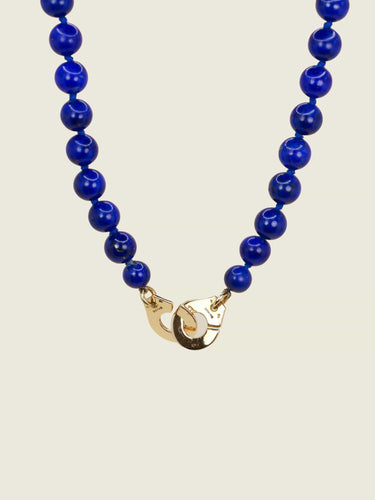 Collier DINH VAN Collier menottes R15 or jaune lapis lazuli 58 Facettes 1204.6