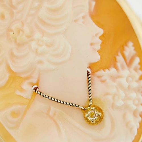 Pendentif Broche pendentif camée en or jaune 58 Facettes 37486