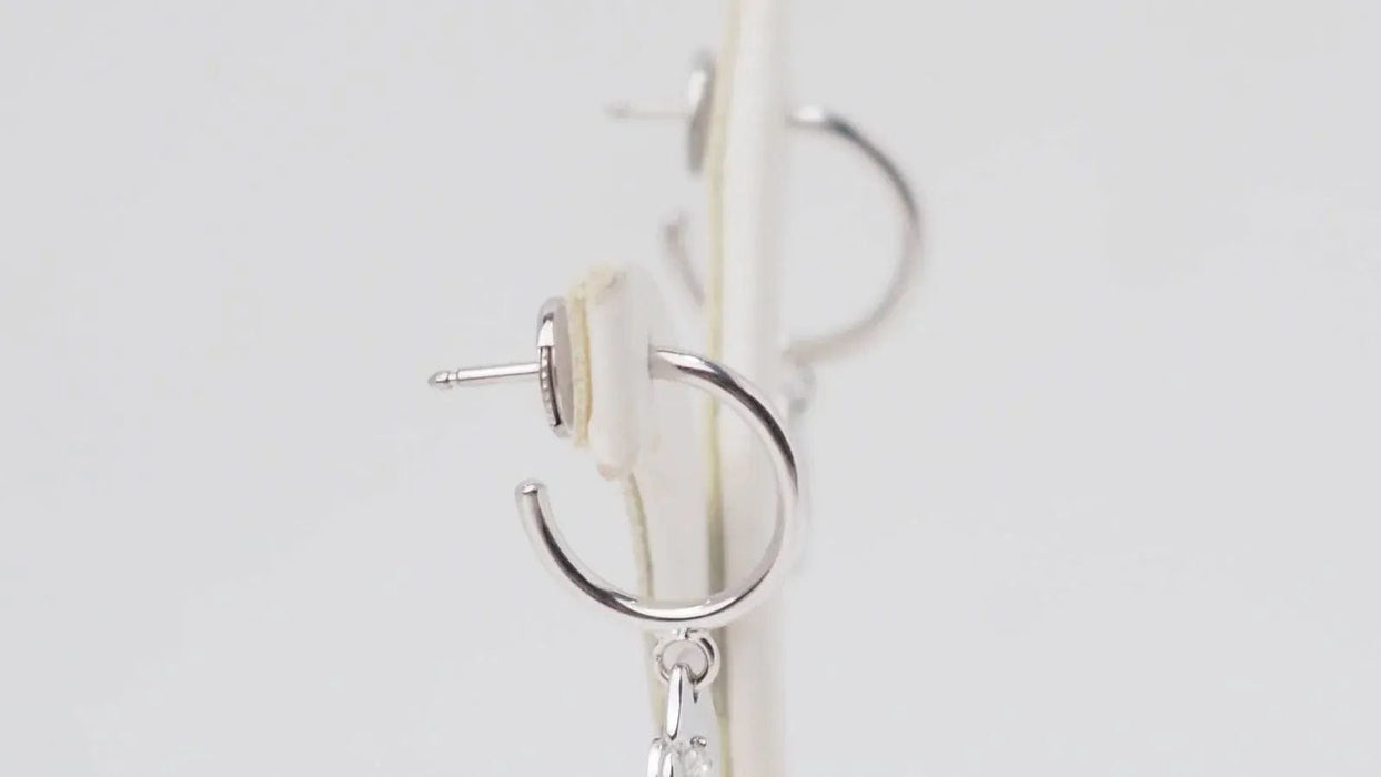 DINH VAN - Boucles d'oreilles menottes en or blanc et diamants