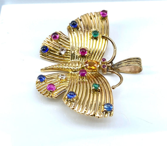 Pendentif papillon en or jaune et pierres précieuses