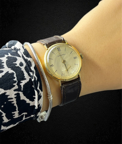 Montre Montre-bracelet Longines Vintage en or jaune 18 carats 58 Facettes