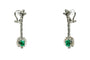 Boucles d'oreilles Longues boucles d'oreilles en or blanc ornées d'émeraudes et de diamants 58 Facettes 50274