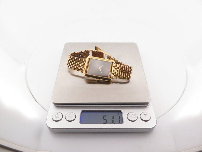 Montre vintage montre baume & mercier tank 37077 mecanique or 18k & oeil de tigre 58 Facettes 268283