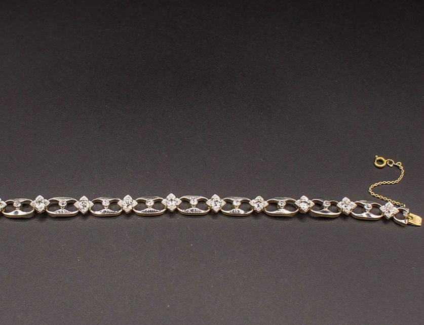 Bracelet Bracelet 1950 or jaune, platine, diamants 58 Facettes A8919