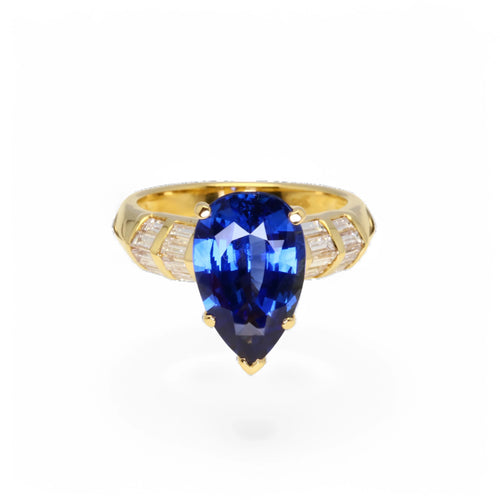 Bague 53 Bague en or jaune ornée d’un saphir bleu Ceylan et de diamants. 58 Facettes