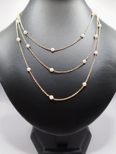 Collier Sautoir en or jaune et perles fines (120 cm) 58 Facettes 1111