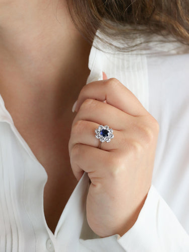 Bague 54 Bague marguerite or blanc, saphir ovale et diamants 58 Facettes 1034.12