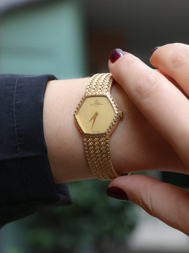 Montre BAUME & MERCIER Montre vintage or jaune maille tressée 58 Facettes 1067.3