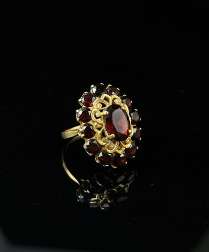 Bague Bague majestueuse en grenat pyrope 58 Facettes