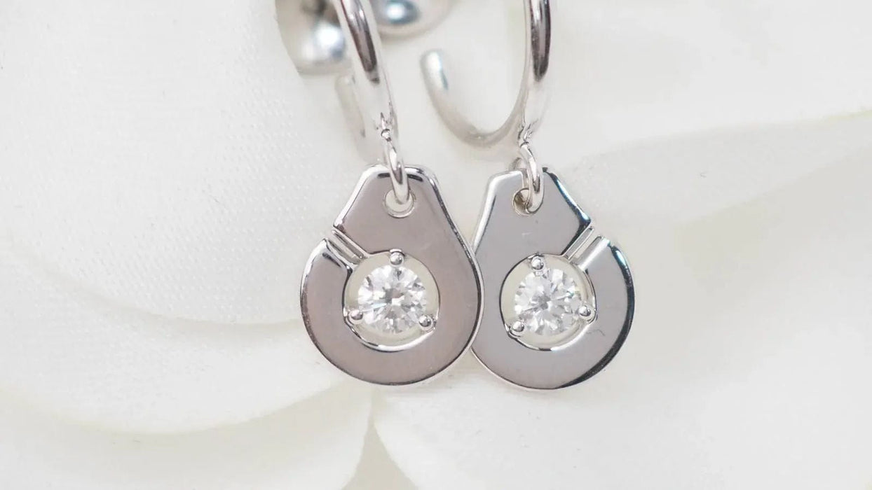 DINH VAN - Boucles d'oreilles menottes en or blanc et diamants