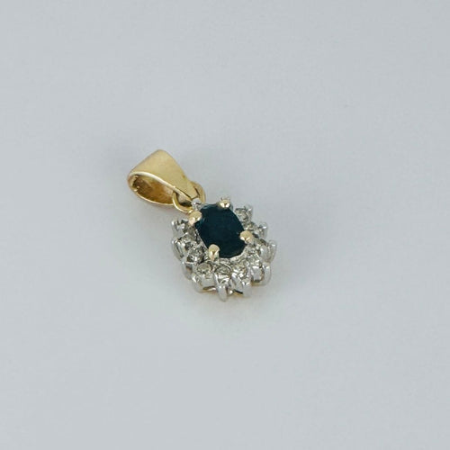 Pendentif Pendentif entourage saphir bleu ovale et diamants en or jaune 18k 58 Facettes 2505001
