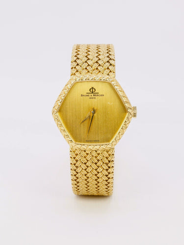 Montre BAUME & MERCIER Montre vintage or jaune maille tressée 58 Facettes 1067.3
