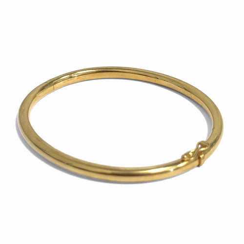 Bracelet jonc ouvrant moyen modèle en or jaune 18k