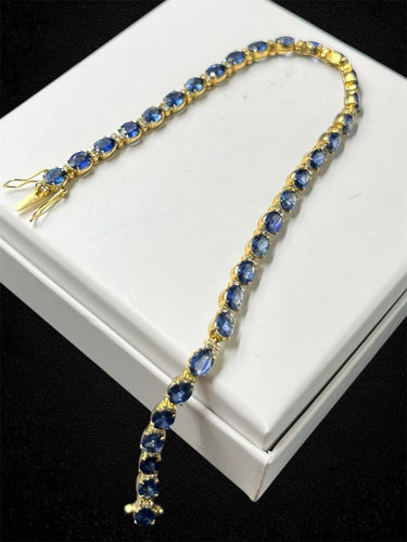 Bracelet Bracelet tennis en or jaune avec saphirs et diamants 58 Facettes