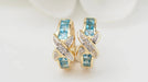 Boucles d'oreilles Boucles d'oreilles créoles or blanc Topaze bleue diamants 58 Facettes 28590