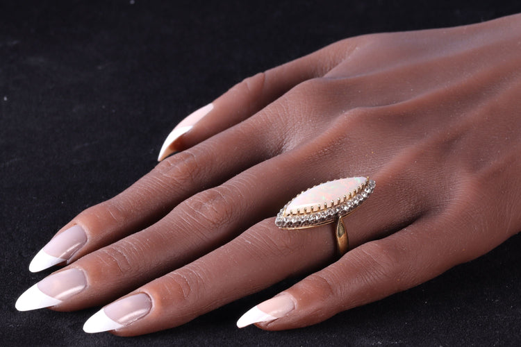Bague 55 L'élégance victorienne : le chef-d'œuvre de la bague en opale et diamant de 1880 58 Facettes 16054-0031