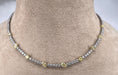 Collier Collier tennis en or blanc 18 carats avec diamants jaunes 58 Facettes G-439