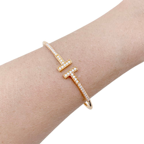 Bracelet Bracelet Tiffany "Wire Tiffany T" en or rose et diamants. 58 Facettes 34827