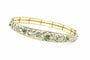 Bracelet Bracelet en or jaune orné de motifs floraux en argent, émeraudes et diamants 58 Facettes 50319
